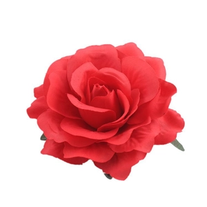 Close-up of red artificial rose hair clip with velvety texture for hair accessories