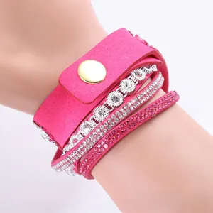Detail of rose pink multi-layer wrap bracelet with rhinestones and gold snap button closure