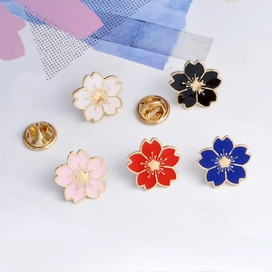 Cute cherry blossom enamel pins in five colors with butterfly clutches and gold finish