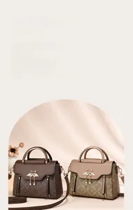 Detail view of retro tote bags with monogram pattern and metal heart pendant detail