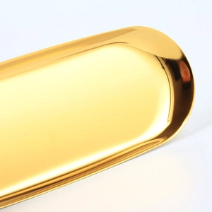 Polished gold stainless steel oval tray with high-gloss finish for jewelry storage
