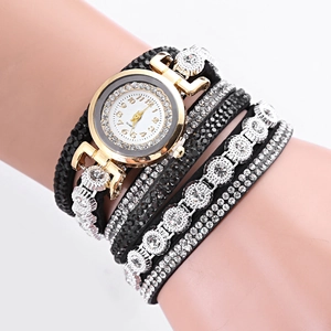 Women's quartz watch with gold crystal bezel and multi-layer diamond wrap bracelet