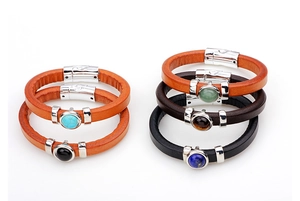 Detail view of multi-strand leather bracelets with turquoise stones and magnetic clasps