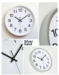 Detail view of silver sand frame and minimalist white dial of a 30cm plastic wall clock