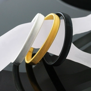 Three-color metal spring sleeve garters for men in gold silver and black finishes