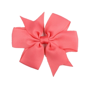 Classic coral pink grosgrain ribbon bow hair clip with textured ribbed finish