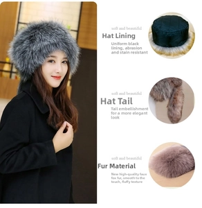 Detail of grey faux fox fur Russian hat showing quilted lining and fluffy tail accessory