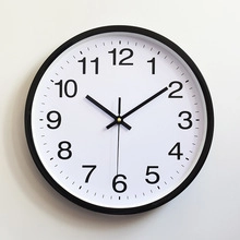 Detailed front view of 14-inch silent wall clock with bold black Arabic numerals