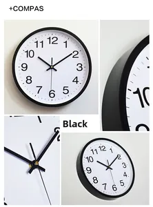 Detail view of a 12-inch modern black wall clock with Arabic numerals and quartz movement