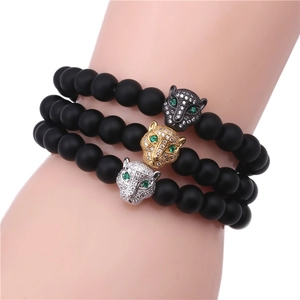 Three-piece black matte bead bracelet set featuring gold, silver, and black leopard heads
