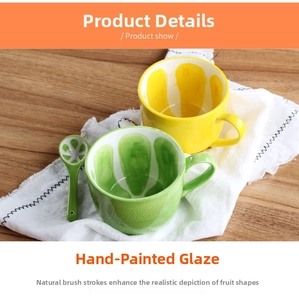 Detail of hand-painted ceramic cups with fruit patterns and matching ceramic spoons