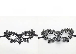 Detail view of soft and hard lace masquerade masks showing intricate floral embroidery patterns