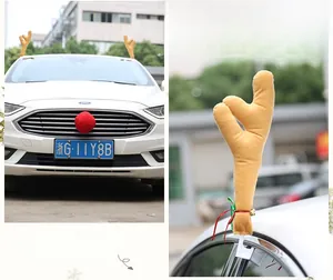 Detailed view of plush reindeer antlers and red nose set for car Christmas decoration