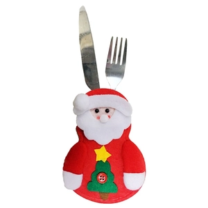 Detail of Santa Claus felt cutlery holder featuring a green Christmas tree and button accents