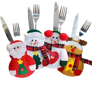 Detail view of 4-pack Christmas cutlery holders featuring Santa, snowman, and reindeer shapes