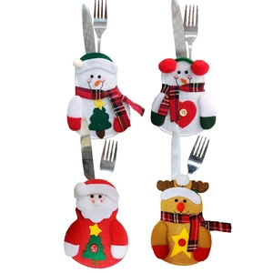 Detailed view of four Christmas snowman and reindeer cutlery holders in a matrix layout