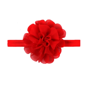Detailed view of a handmade red chiffon flower attached to an elastic baby headband