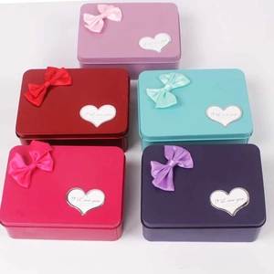 Five colored rectangular metal gift boxes with silk bows and heart-shaped I Love You tags