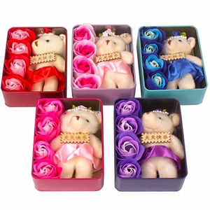 Detail view of five assorted heart soap flower gift boxes with small plush bears