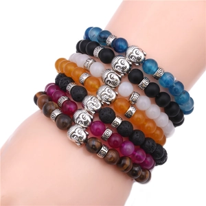8mm Buddha head stone bracelets in Tiger Eye, Agate and Volcanic rock on model wrist