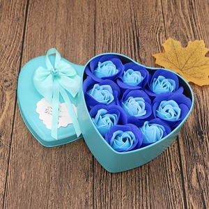 Detail of light blue heart-shaped soap flower gift box with nine roses and a bow