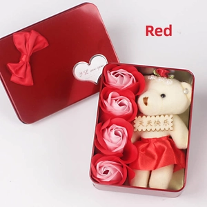 Detail of red heart tin box with teddy bear and pink soap roses for Mother's Day gift