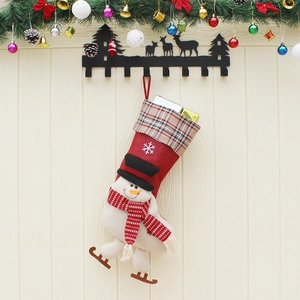 Large red Christmas stocking with 3D snowman, skating boots and festive snowflake patterns