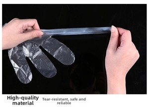 Detail showing the high toughness and tear resistance of transparent PE disposable gloves