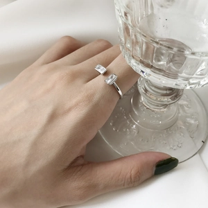 Macro shot of a 925 sterling silver ring with dual rectangular cubic zirconia stones