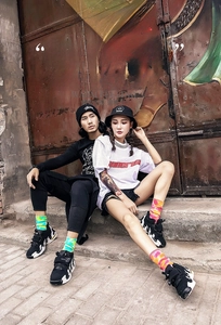Street style tie-dye crew socks in yellow-green and pink-orange knit on model