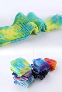 Detail of ribbed tie-dye cotton socks featuring vibrant color patterns and soft texture