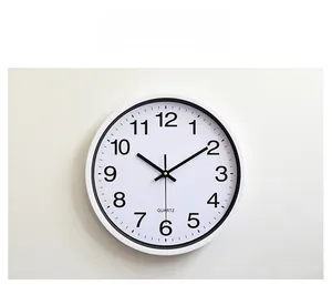 Close-up of 12-inch wall clock dial showing black inner frame and large numbers