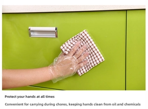 Close-up of clear disposable PE gloves protecting hands during kitchen cabinet cleaning