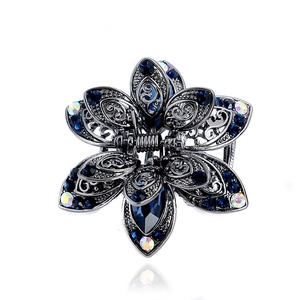 Vintage hollow alloy hair claw with deep blue crystals and rhinestones for women