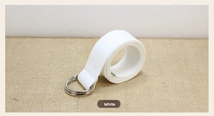 Detailed texture of white canvas belt with durable double D-ring metal buckles
