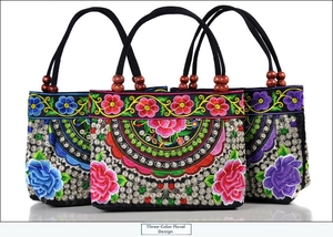 Three colors of ethnic canvas handbags with floral embroidery and wooden bead handles