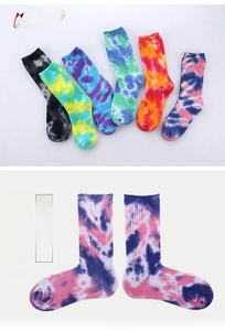 Detail showing various handmade tie-dye patterns and ribbed cuffs of cotton crew socks