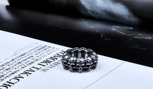 Macro shot of punk gothic skull ring in vintage oxidized silver finish with 3D details