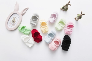 Pack of 11 multi-color cotton low-cut socks for kids shown on white background