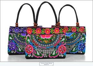 Detailed view of three-color rose embroidery and wooden bead accents on canvas bags