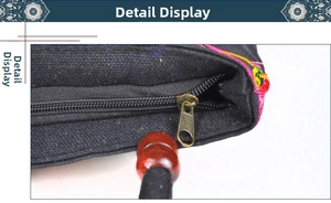 Close-up of retro metal zipper with wooden beads on embroidered ethnic canvas bag