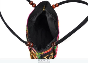 Detailed interior view of ethnic embroidered handbag with secure zipper closure