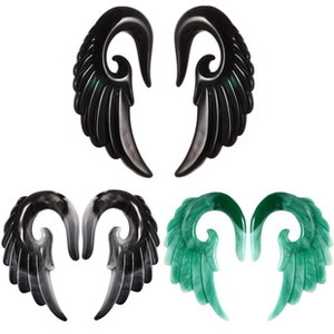 Detailed set of acrylic wing ear gauges in black and marble patterns on white background