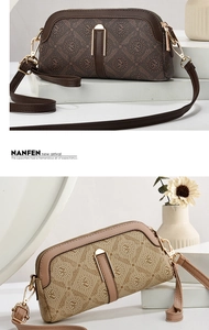 Detail of vintage patterned crossbody bags in brown and beige with gold hardware