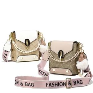 Detail view of stylish crossbody bags with classic pattern and fabric shoulder straps
