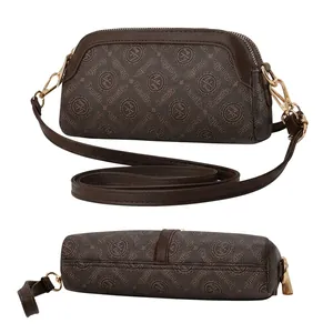 Detail view of the brown monogram crossbody bag side and bottom with golden hardware