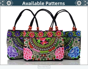 Detail of ethnic canvas handbag with peony embroidery and decorative wooden beads