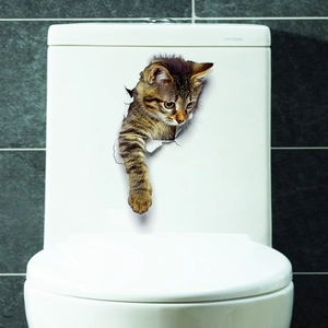 Realistic 3D tabby cat wall sticker with broken wall effect on a white toilet tank