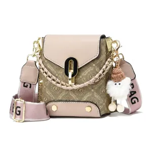 Detail view of small crossbody bag with 17x17x10cm dimensions and metal chain handle