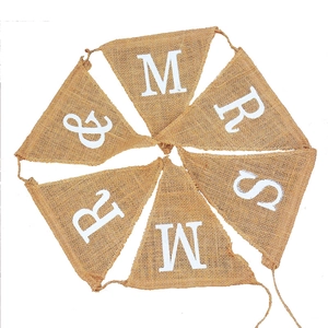 Detailed view of MR & MRS burlap bunting banner with white letters for wedding decor